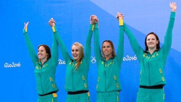 Silver medalists Emily Seebohm, Taylor McKeown, Emma McKeon and Cate Campbell celebrate on the podium during the medal ceremony for the Women's 4 x 100m Medley Relay Final.