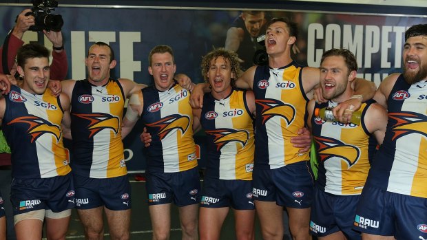 The Eagles sing their team song after winning the second preliminary final against North Melbourne in Perth in 2015. 