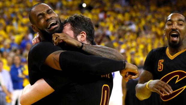 Tears of joy: LeBron James celebrates with Kevin Love.