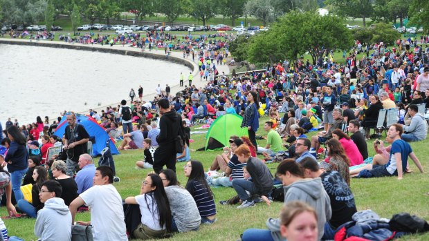 People gather for the Australia Day fireworks on the shores of Lake Burley Griffin. Canberra's population was hovering around 392,000 in the middle of 2015 and will probably reach 400,000 within the next 12 months.