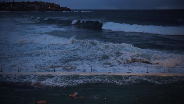Swimmers were protected in the Bondi Icebergs pool on Monday morning, as large waves pounded the beach.