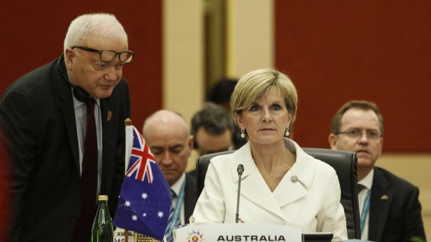 Australian Foreign Minister Julie Bishop listens to her staff before the ASEAN meeting on Wednesday.