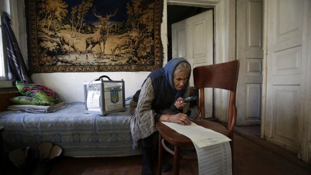 Election day: A woman votes at home in the village of Gornostaypol, north of Kiev.
