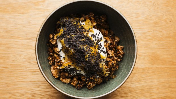 The popcorn granola is topped with yoghurt and pineapple. 