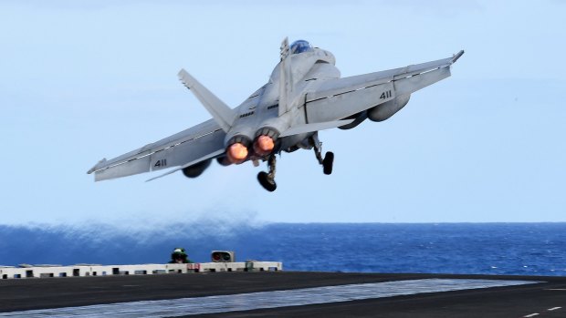 An F/A-18F Super Hornet takes off from the USS Ronald Reagan when it was in the Coral Sea earlier this week, about 650km off the Queensland coast. 