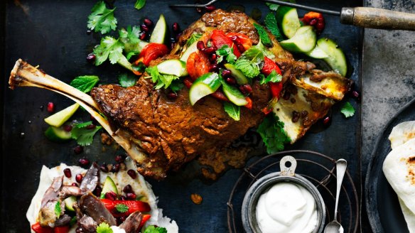 Lamb shoulder with tahini yoghurt, pickled cucumbers, pomegranate and herbs.