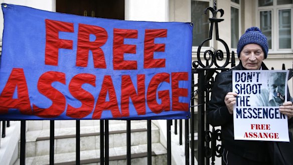A demonstrator outside Ecuador's London embassy.