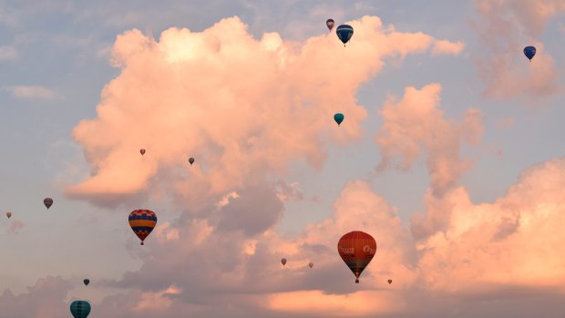 The peaceful scene of balloons floating in the Canberra sky.