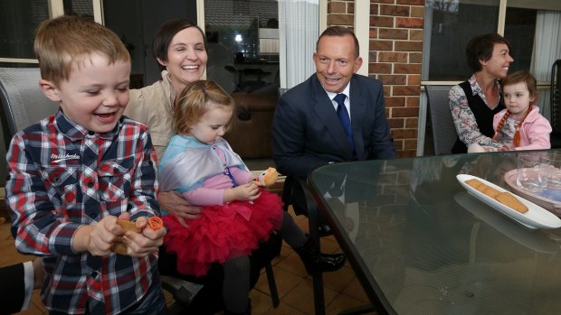 Prime Minister Tony Abbott meets with Skye Mendl (left) and her children Austin and Evelyn, and Vanessa Burdett (right) and her daughter Stella on Monday.