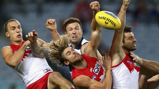 In the absence of Ted Richards (left), Dean Rampe and Heath Grundy have maintained great strength in the Swans backline.