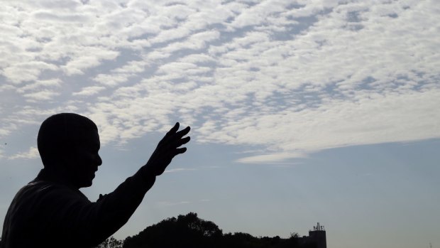 A bronze statue of former South Africa President Nelson Mandela stands outside the Union Buildings in Pretoria.