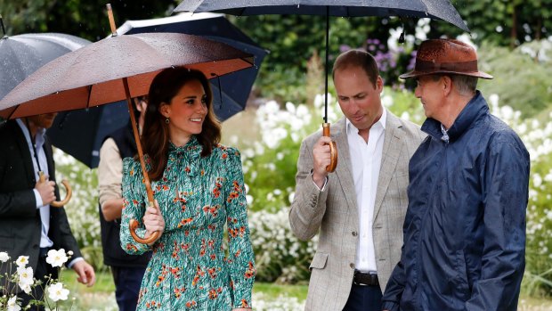 William and his wife Kate, Duchess of Cambridge are given a tour at the memorial garden in Kensington Palace.