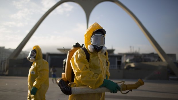 A health worker stands in the Sambadrome as he sprays insecticide to combat mosquitoes that transmit the Zika virus in Rio de Janeiro, Brazil.