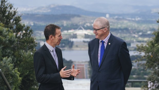 Territory and Municipal Services Minister Shane Rattenbury and National Capital Authority chief executive Malcolm Snow at the top of Mount Ainslie.