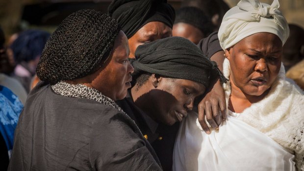 Akon Guode at the funeral for her three children in 2015.