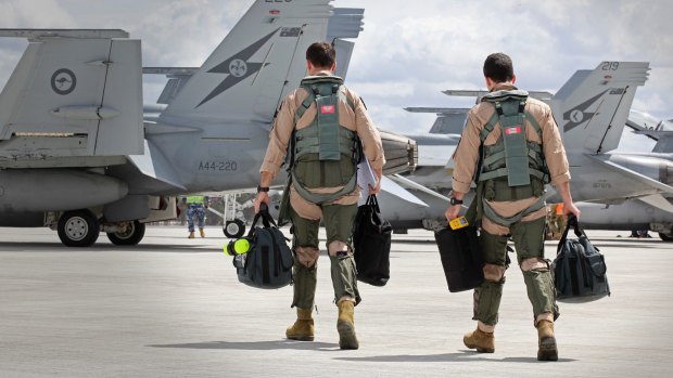 WAGES OF WAR: A RAAF Super Hornet crew prepare to depart to the Middle East.