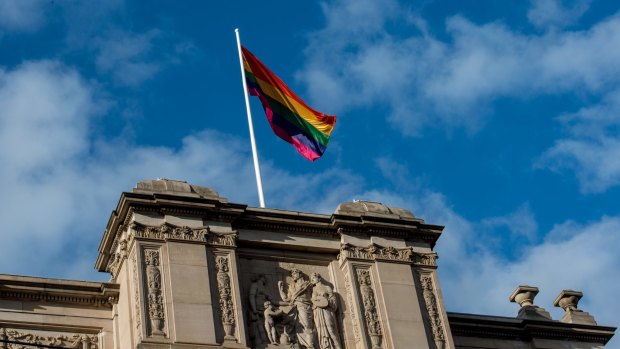The rainbow flag flying above Victoria's Parliament House.