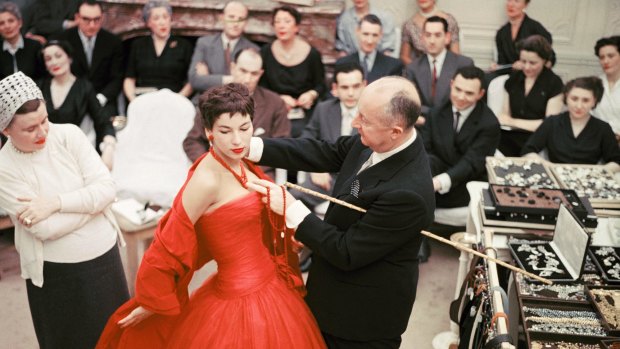 Christian Dior with fashion model Victoire wearing the "Zaire" dress in 1957.