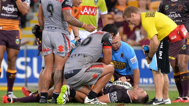 Nasty knock: Corey Oates receives treatment before leaving the field with a shoulder injury.
