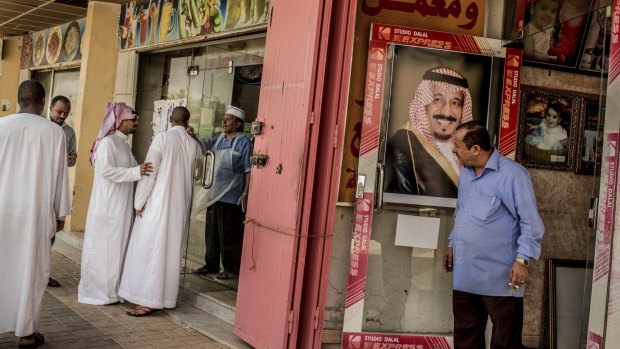 An image of King Salman hangs at a photo studio in Riyadh last year. 