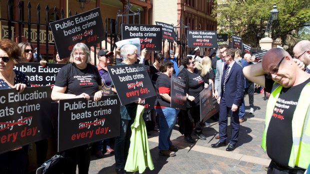 Unions across NSW are rallying against the Baird government's plans to privatise the work of prison teachers.