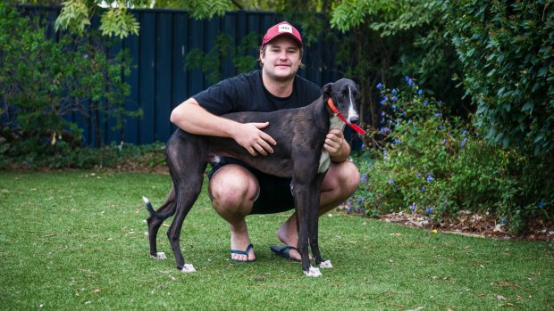 Greyhound trainer Jonte Brown and his winning dog Ron's Bookshoop. Photo: Dion Georgopoulos