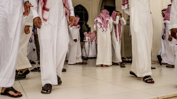 Men leave a mosque after prayers in Riyadh last year. 