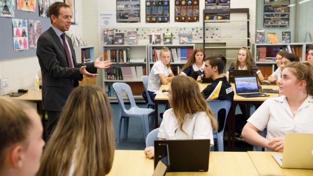 ACT Road Safety Minister Shane Rattenbury discusses proposed changes for P plate drivers with Year 10 students at Mt Stromlo High School on Tuesday. 