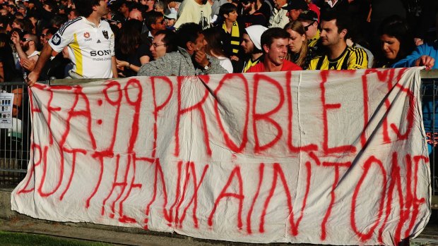 Banner banter: Wellington Phoenix fans make their feelings known at Saturday's game against Melbourne Victory.