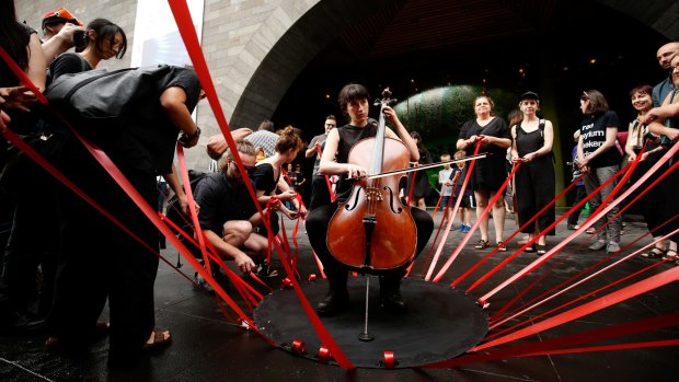 Artists protesting outside NGV International in November.