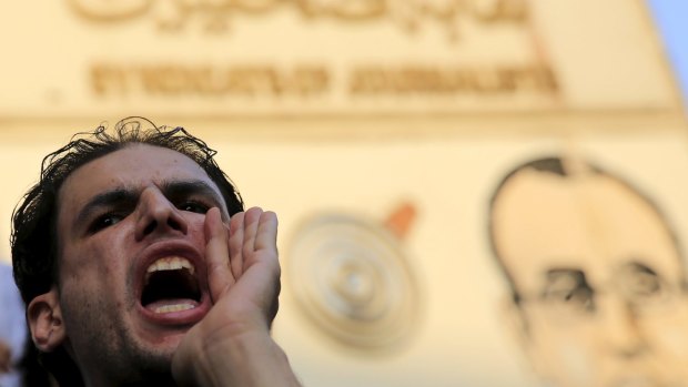 A journalist shouts slogans against the Interior Ministry during a protest in Cairo on Monday.