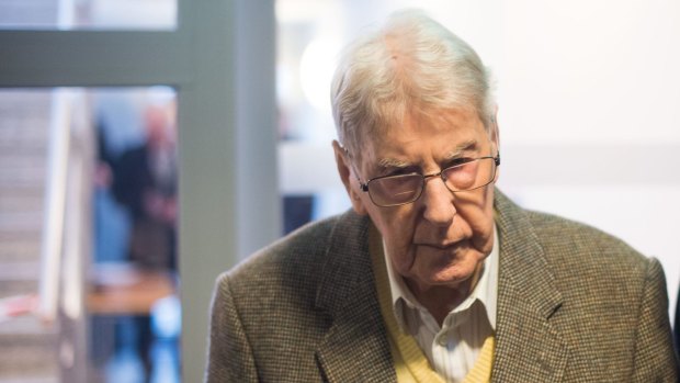 Former SS guard at the Auschwitz death camp, Reinhold Hanning, 94, arrives for his trial.