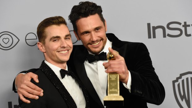 James Franco (r) with brother Dave following his Golden Globes win for best actor.