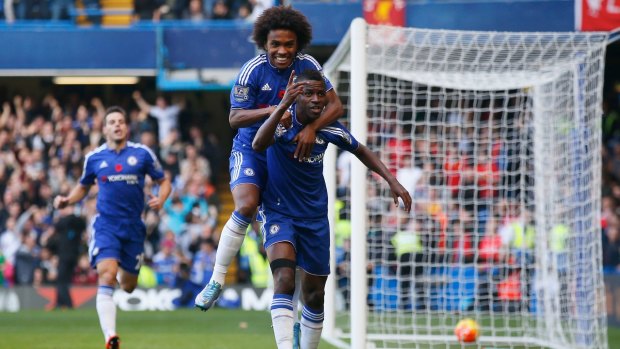 Temporary delight: Ramires is congratulated by Willian after opening the scoring.