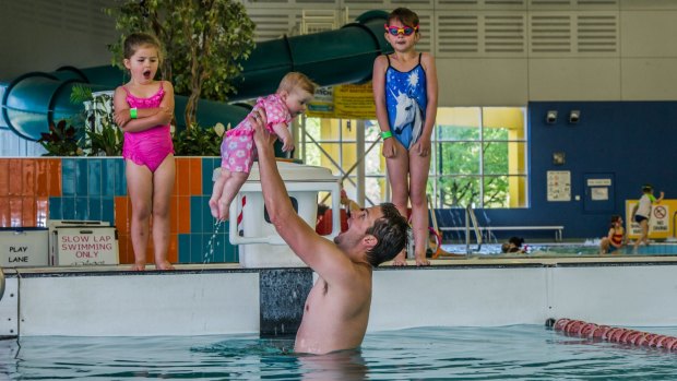 Canberra police officer Paul Reynolds (pictured with daughters Ruby, 5, Poppy, 3, and May, 6 months) is a recipient of the Churchill Fellowship for his work in trying to reduce incidents of drowning, particularly among young children. 