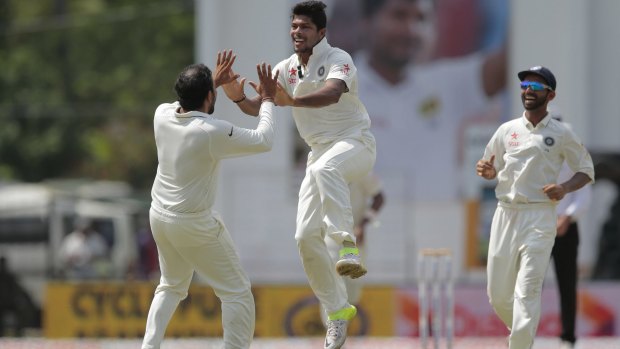 India's Umesh Yadav celebrates after taking the wicket of Sri Lanka's captain Angelo Mathews.