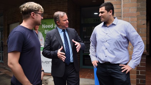 Anthony Albanese (centre) in front of his Marrickville office, Sydney, with two locals affected by the Centrelink debt clawback - Curtis Dickson, 31 (left) and Tony Barbar, 29 (right).