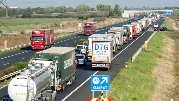 A long queue of vehicles waits on the M1 motorway near the border between Hungary and Austria near Mosonmagyarovar on Monday as every vehicle capable of smuggling people is checked at the border.