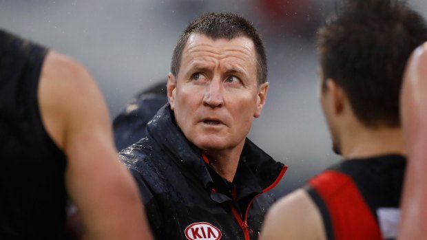 Pressure points: Dons coach John Worsfold during the downpour at the MCG.