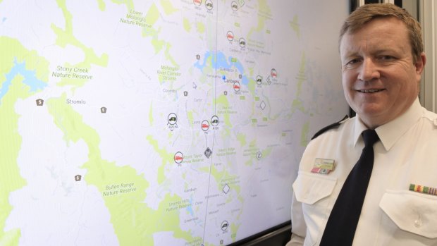 Emergency Services commissioner Dominic Lane next to a live map of incidents firefighters and paramedics are attending at the ESA headquarters in Fairbairn.