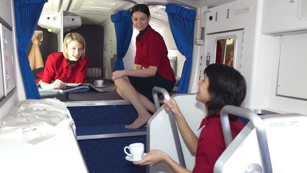 The cabin crew in a rest area on board a Boeing 777, which sits above the economy class cabin.