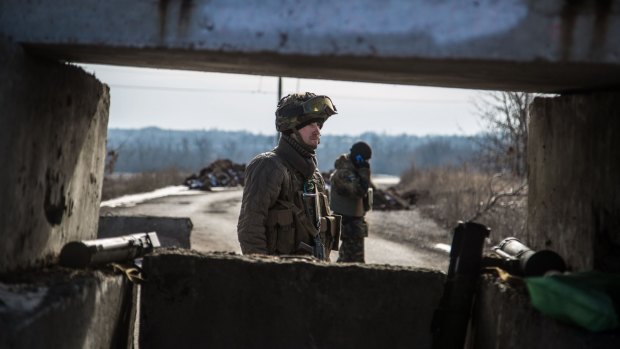Ukrainian servicemen guard a checkpoint in Novoluganskoye, near Artemivsk in the Donetsk region. 