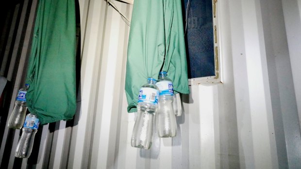 Bottles collecting rainwater to use for drinking at the former Manus Island detention centre.