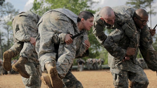 Captain Kristen Griest, centre, participates in combatives training during the Ranger Course at Fort Benning, Georgia, in April. 