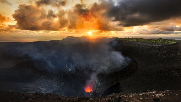 The active volcano at Mount Yasur, erupting at sunrise. 