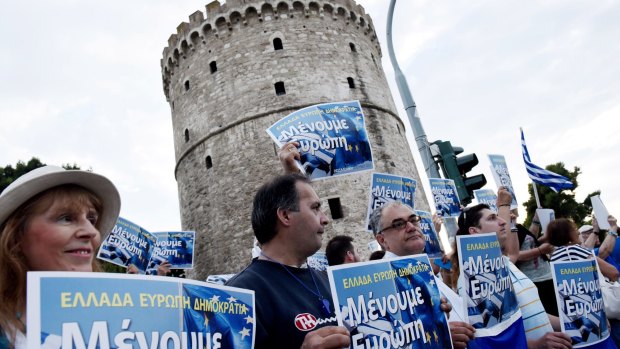 Pro-Euro demonstrators gather during a rally in the northern Greek city of Thessaloniki's landmark White Tower.