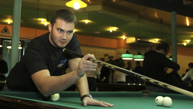 Viktor Yanukovych, son of Ukraine's deposed president Viktor Yanukovych, plays billiards in Donetsk in 2010.