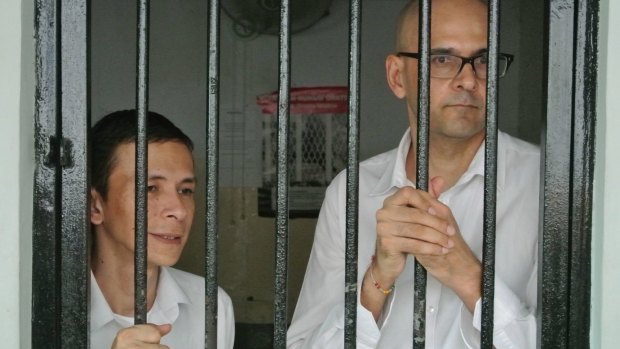 Indonesian teacher's aide Ferdinant Tjiong (left) and Canadian teacher Neil Bantleman had their prison sentences reinstated in February.