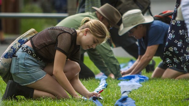 Signing a giant ribbon at the Womens March.