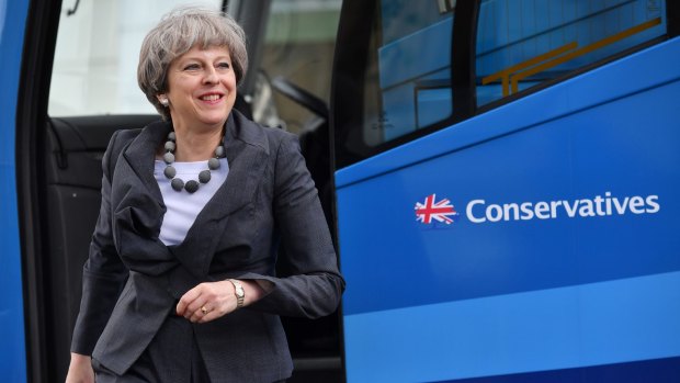 Theresa May steps off the bus to visit the Cheltenham Science Festival on June 6.